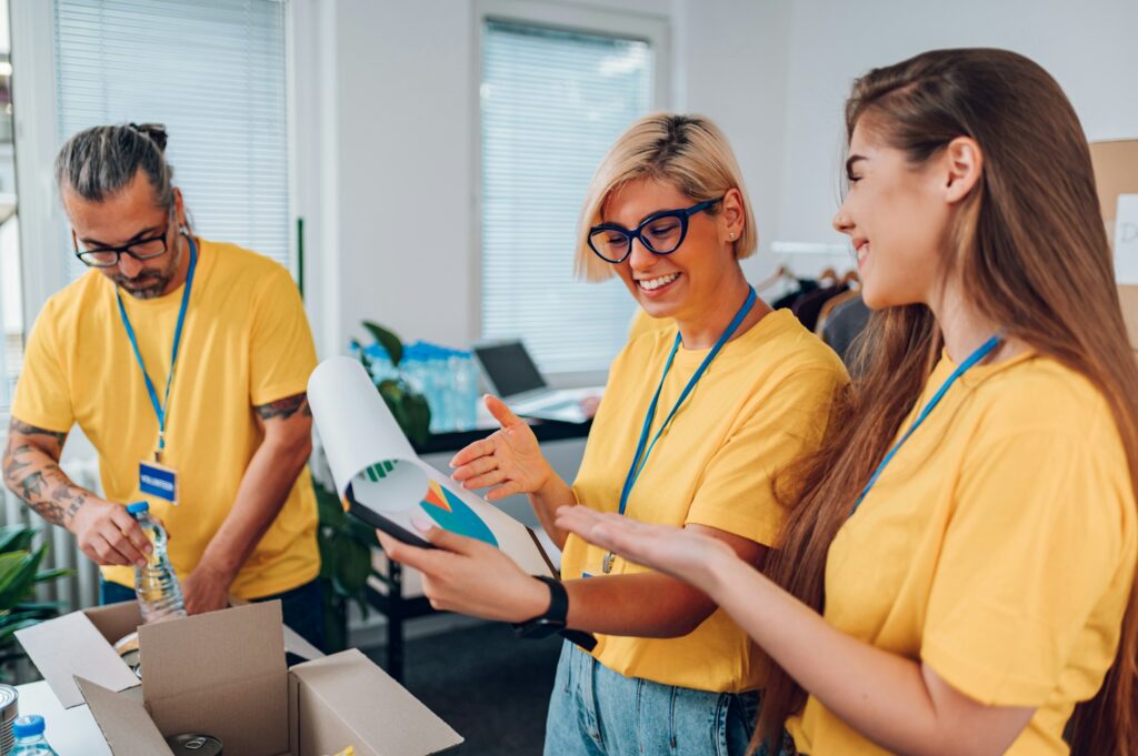 Group of volunteers working in community charity donation center