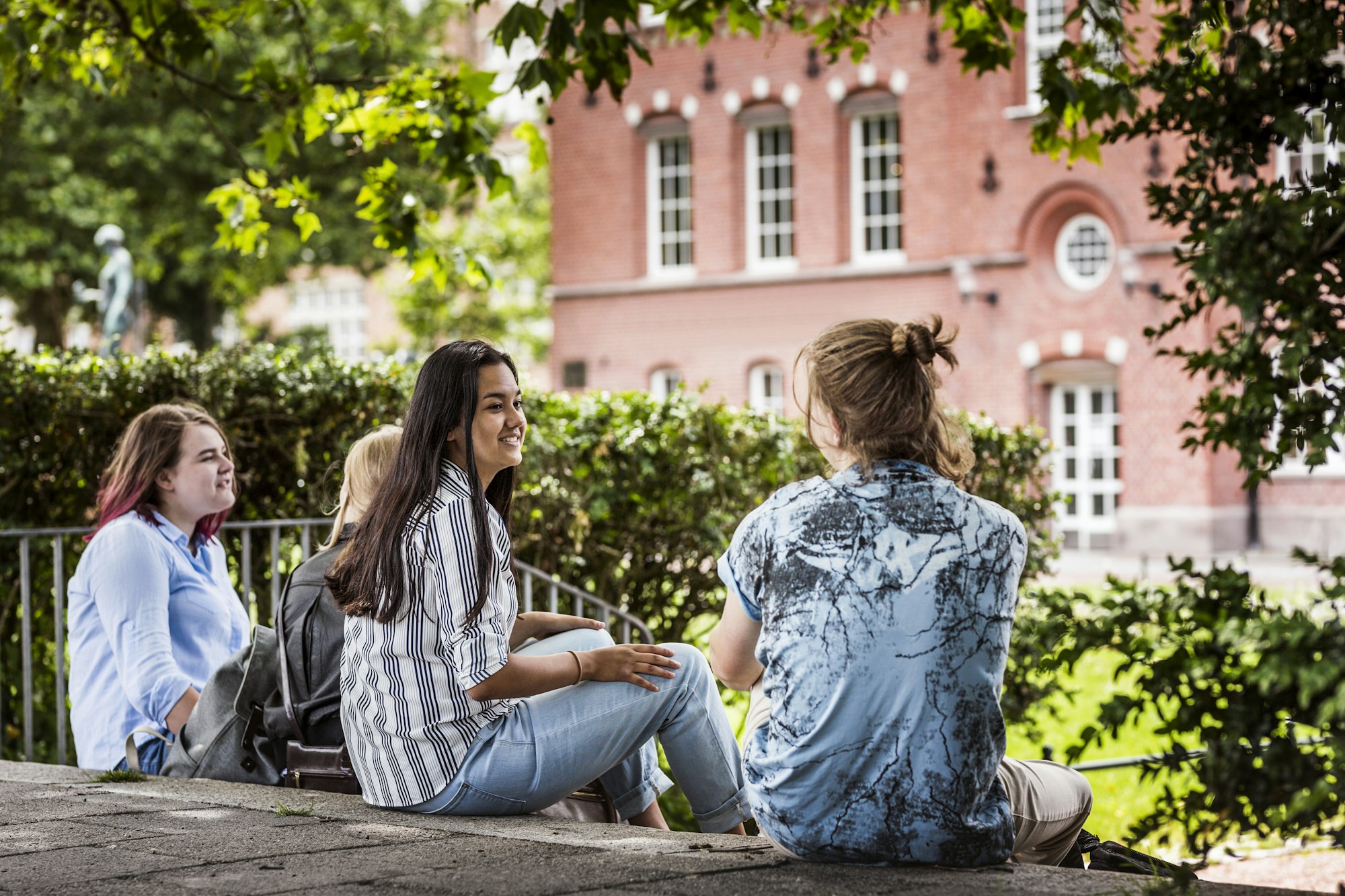 Students meeting up for study session outside library.